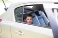 Cheerful joyful child in the car