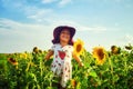 Cheerful joyful child in the field with sunflowers . Royalty Free Stock Photo