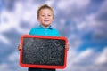 Cheerful Kid with Blank Board with symbols on board.