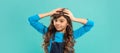 cheerful kid with curly hair. teen beauty hairstyle. female fashion model. frizzy hair curl. Royalty Free Stock Photo