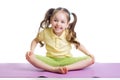 Cheerful kid girl doing exercises on fitness mat Royalty Free Stock Photo