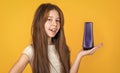 cheerful kid girl with long straight hair hold conditioner shampoo or gel bottle, bath Royalty Free Stock Photo