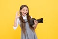 cheerful kid girl take photo with digicam show ok gesture, photography Royalty Free Stock Photo