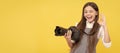 cheerful kid girl take photo with digicam show ok gesture, photography. Child photographer with camera, horizontal Royalty Free Stock Photo