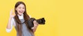 cheerful kid girl take photo with digicam show ok gesture, photography. Child photographer with camera, horizontal Royalty Free Stock Photo