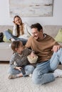 cheerful kid with remote controller looking