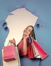 cheerful kid with shopping bags. cute child shopper. teenager girl shopaholic.