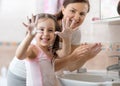 Kid washing hands and showing soapy palms Royalty Free Stock Photo