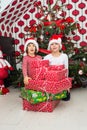 Cheerful kids with many presents