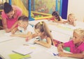 Cheerful kids at school lesson Royalty Free Stock Photo