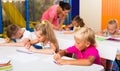 Cheerful kids at school lesson Royalty Free Stock Photo