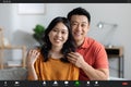 Cheerful korean couple having video conference with friends, screenshot