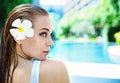 Cheerful lady relaxing by the hotel`s swimming - pool Royalty Free Stock Photo