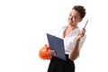 Cheerful lady with short dark hair, in beautiful office suit, orange comstruction helmet plans something with tablet Royalty Free Stock Photo