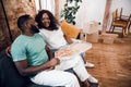 Happy couple having meal in new flat stock photo