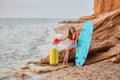 Cheerful lady on summer holiday. Surfing in ocean, sense of adventure and relaxation time on nature concept. Copy space Royalty Free Stock Photo