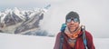 Cheerful laughing climber in sunglasses portrait with backpack ascending Mera peak high slopes at 6000m enjoying legendary Mount Royalty Free Stock Photo