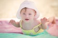 Cheerful little baby girl with Downs Syndrome playing in the pool