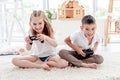 Little boy and girl playing video game Royalty Free Stock Photo