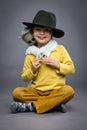 Cheerful little boy with spook, Halloween celebration