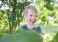 Cheerful little boy with his face smeared with mulberry juice around his mouth Royalty Free Stock Photo