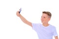 A cheerful little boy is making a selfie. Royalty Free Stock Photo