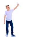 A cheerful little boy is making a selfie. Royalty Free Stock Photo