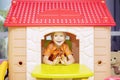 Cheerful little boy playing in a playhouse Royalty Free Stock Photo