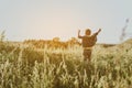 Jocund child rejoicing beautiful morning on nature