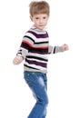 Cheerful little boy in a striped sweater and blue Royalty Free Stock Photo