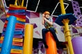 Little boy on zip line, young climber in helmet Royalty Free Stock Photo