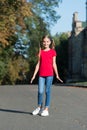 Cheerful little girl adorable ponytails hairstyle outdoors, carefree childhood concept Royalty Free Stock Photo