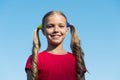 Cheerful little girl adorable ponytails hairstyle outdoors, healthy hair concept Royalty Free Stock Photo