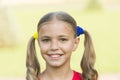 Cheerful little girl adorable ponytails hairstyle outdoors, positivity concept Royalty Free Stock Photo