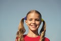 Cheerful little girl adorable ponytails hairstyle outdoors, true happiness concept Royalty Free Stock Photo