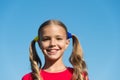 Cheerful little girl adorable ponytails hairstyle outdoors, true happiness concept Royalty Free Stock Photo