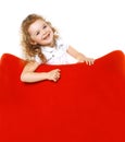 Cheerful little girl on armchair Royalty Free Stock Photo