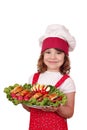 Cheerful little girl cook with gourmet food