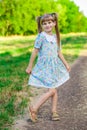 Cheerful little girl on a green grass Royalty Free Stock Photo