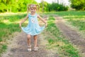 Cheerful little girl on a green grass Royalty Free Stock Photo