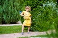 Cheerful little girl on a green grass Royalty Free Stock Photo