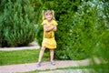 Cheerful little girl on a green grass Royalty Free Stock Photo