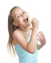 Cheerful little girl with lollipop singing