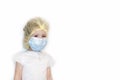 Cheerful little girl plays a doctor, isolated. child in a medical uniform, hat, mask. baby in white uniform. Royalty Free Stock Photo
