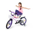 Cheerful little girl on a sports bike on a white background