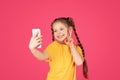 Cheerful Little Girl Taking Selfie On Smartphone And Showing Peace Gesture Royalty Free Stock Photo