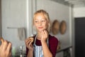 Funny cute girl eating chocolate cookie Royalty Free Stock Photo