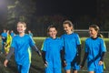 cheerful little girls in football uniforms having a break during soccer practice, medium shot, teenage girls football Royalty Free Stock Photo