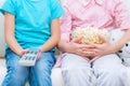 Cheerful little sisters sitting on the sofa Royalty Free Stock Photo