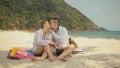 The cheerful love couple holding and eating slices of watermelon on tropical sand beach sea. Romantic lovers two people Royalty Free Stock Photo